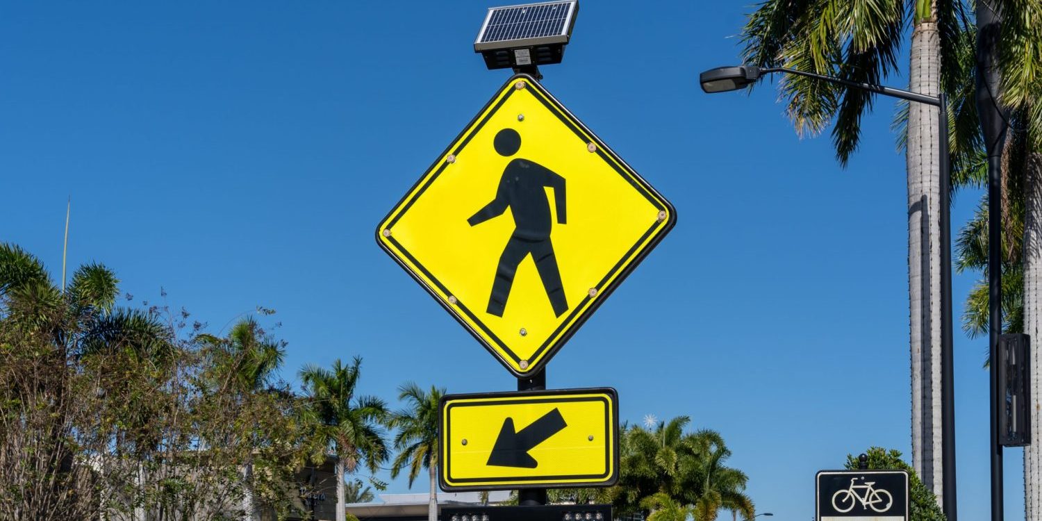 Sarasota, Florida, USA – January 11, 2022: A Pedestrian Crossing Sign is shown.
