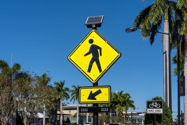 Sarasota, Florida, USA – January 11, 2022: A Pedestrian Crossing Sign is shown.